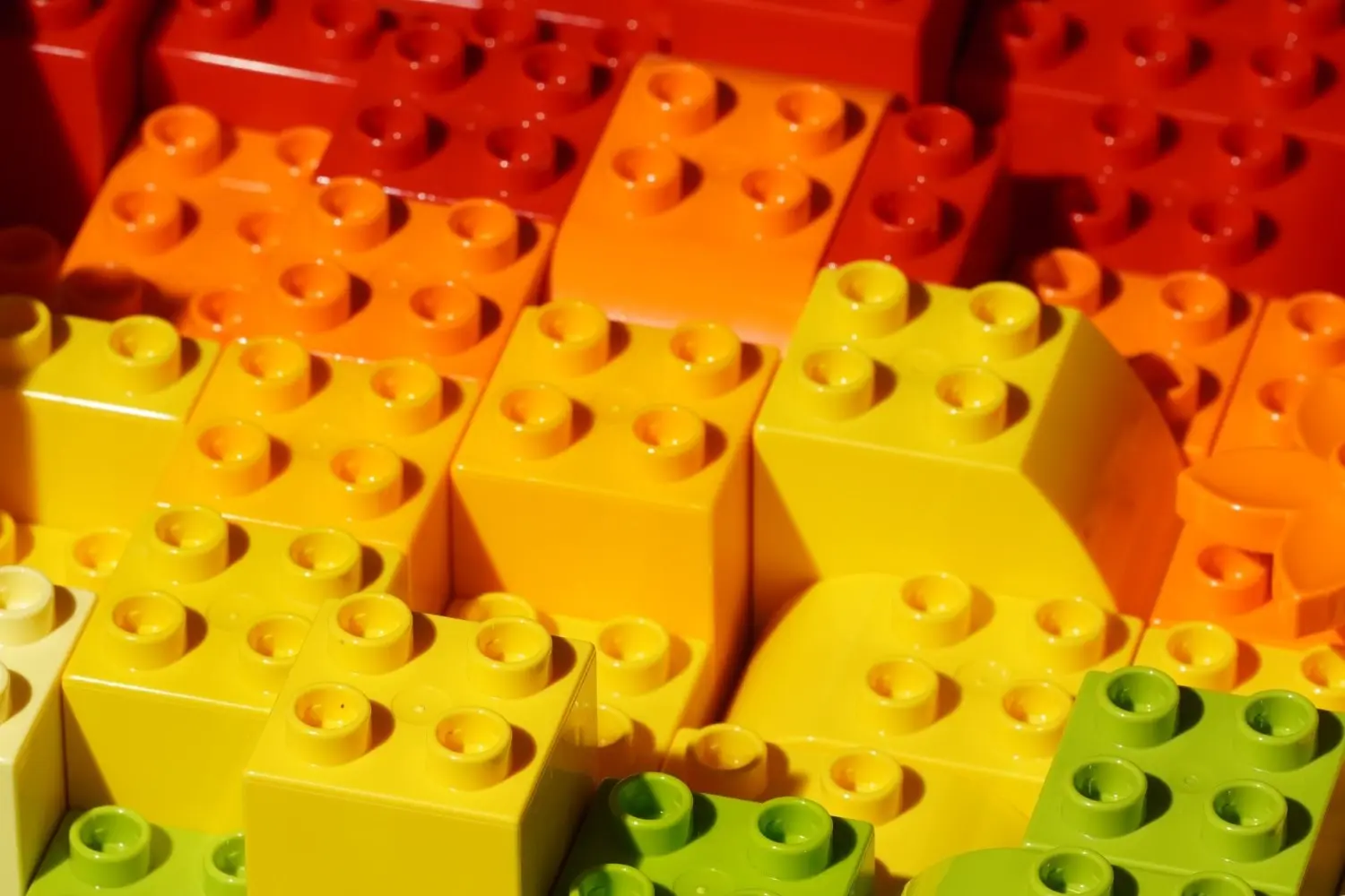 Block of red orange yellow and green lego